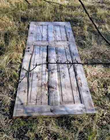 Door lies on the ground