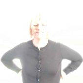 Anna with her arms in her sides